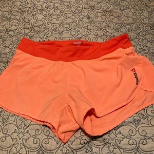 Reebok orange speedwick running shorts